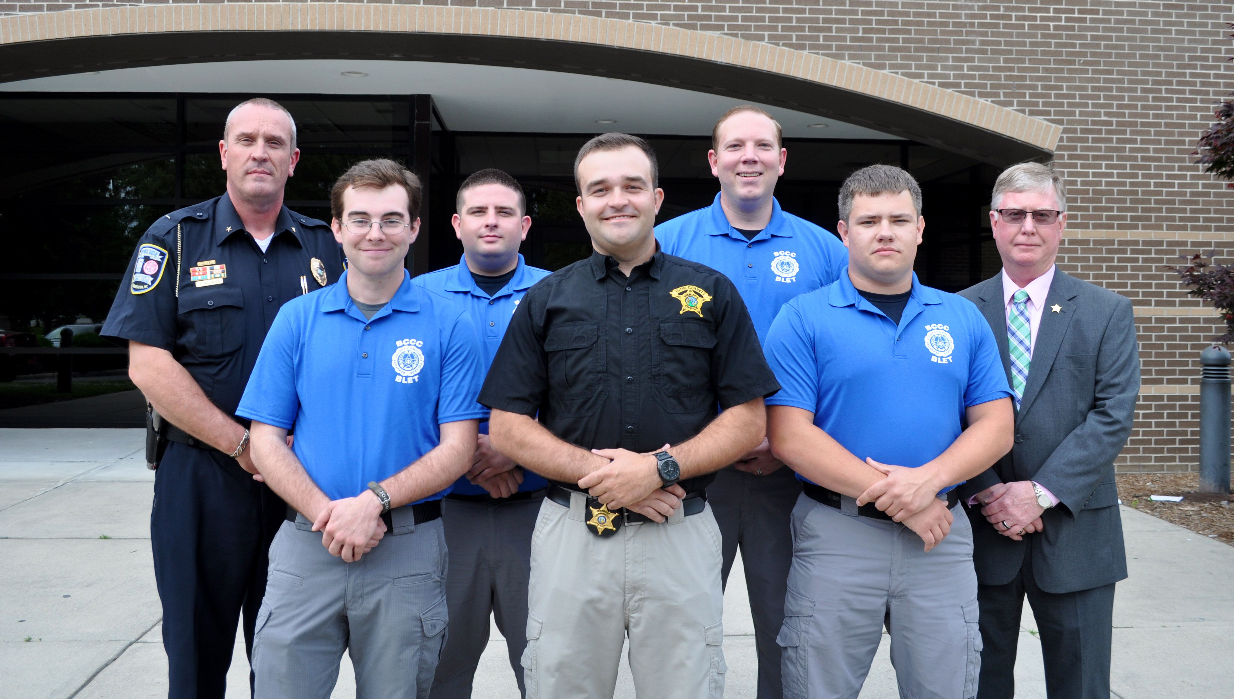 Five law enforcement grad with two staff.