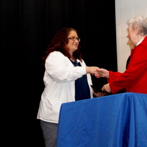 Candice Bell receives her certification for phlebotomy