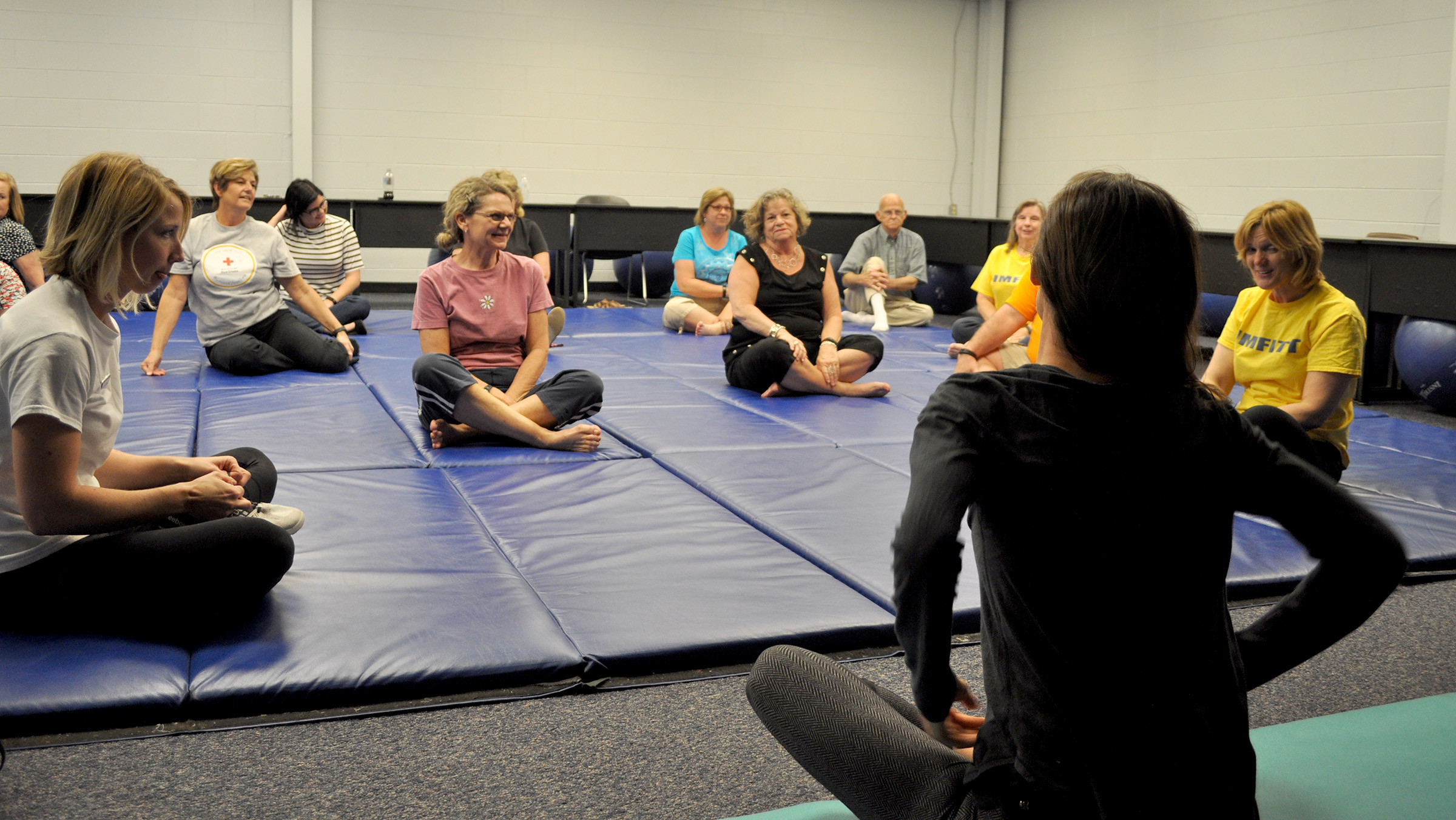 beaufitt participants doing yoga and stretching.