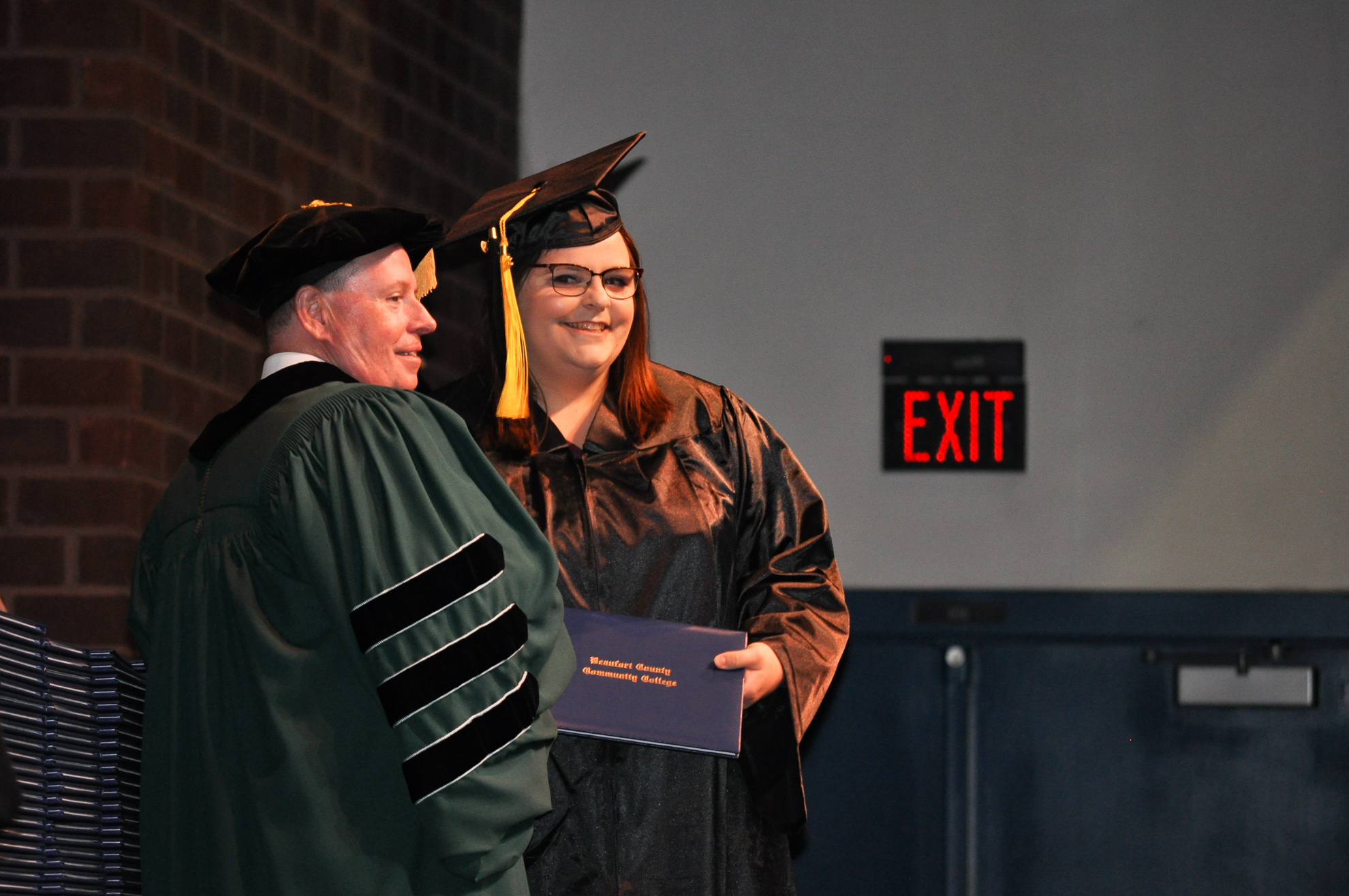 A person receives a diploma at graduation.