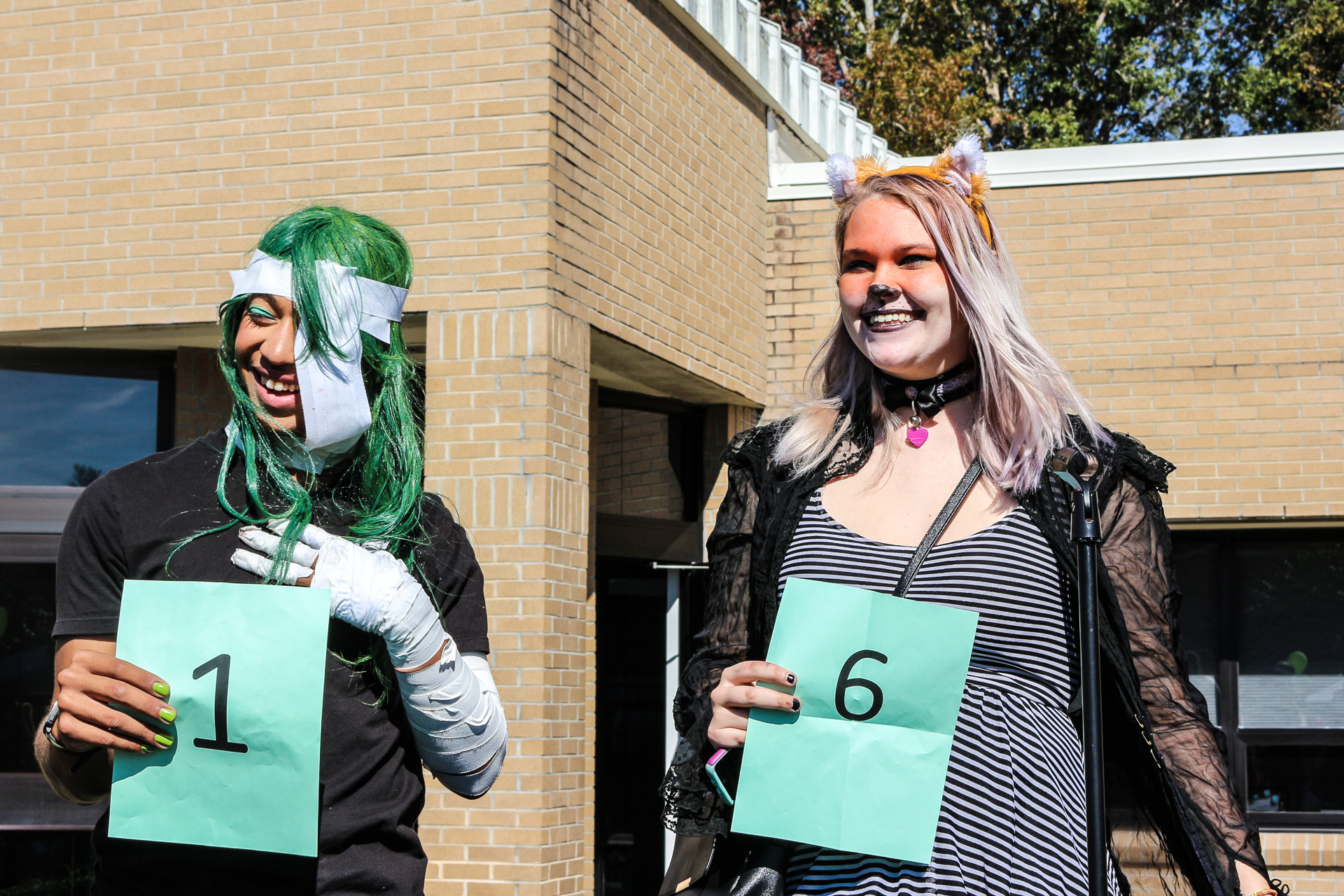two students in costumes.