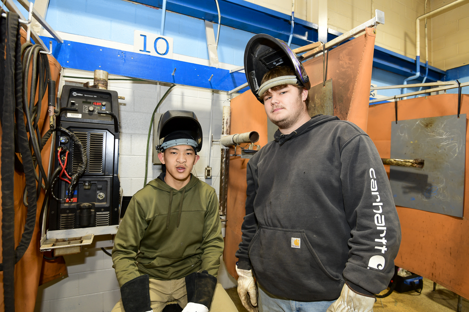 two students in welding gear