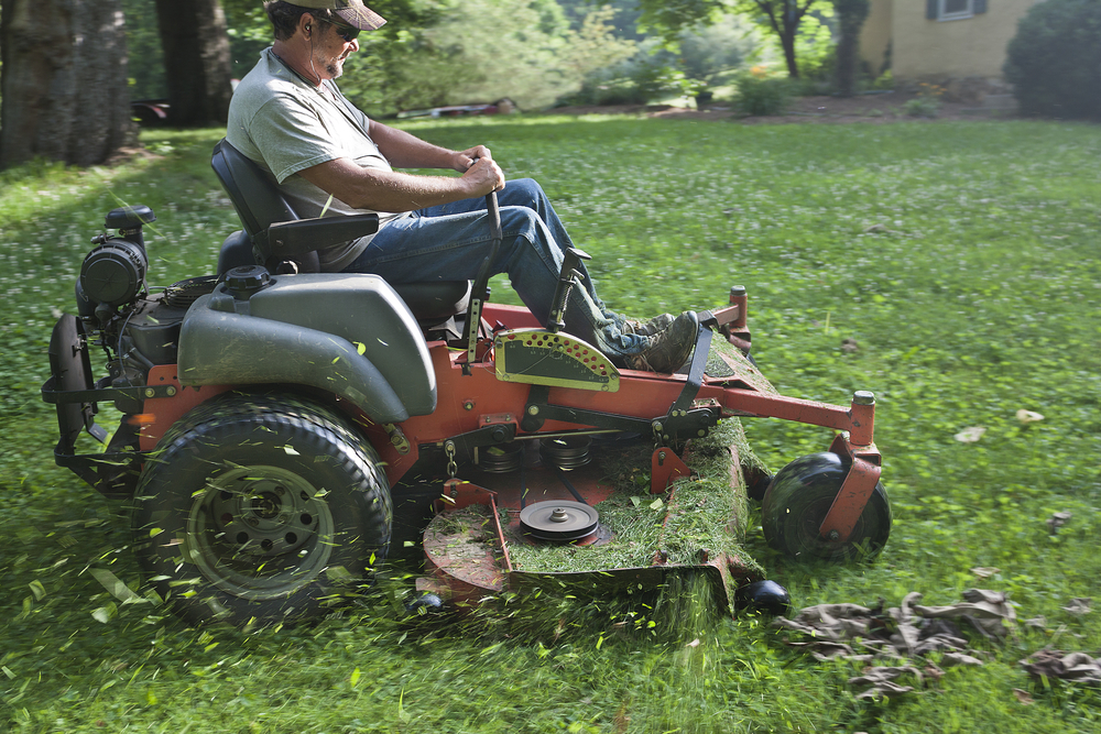 A person on a riding mower