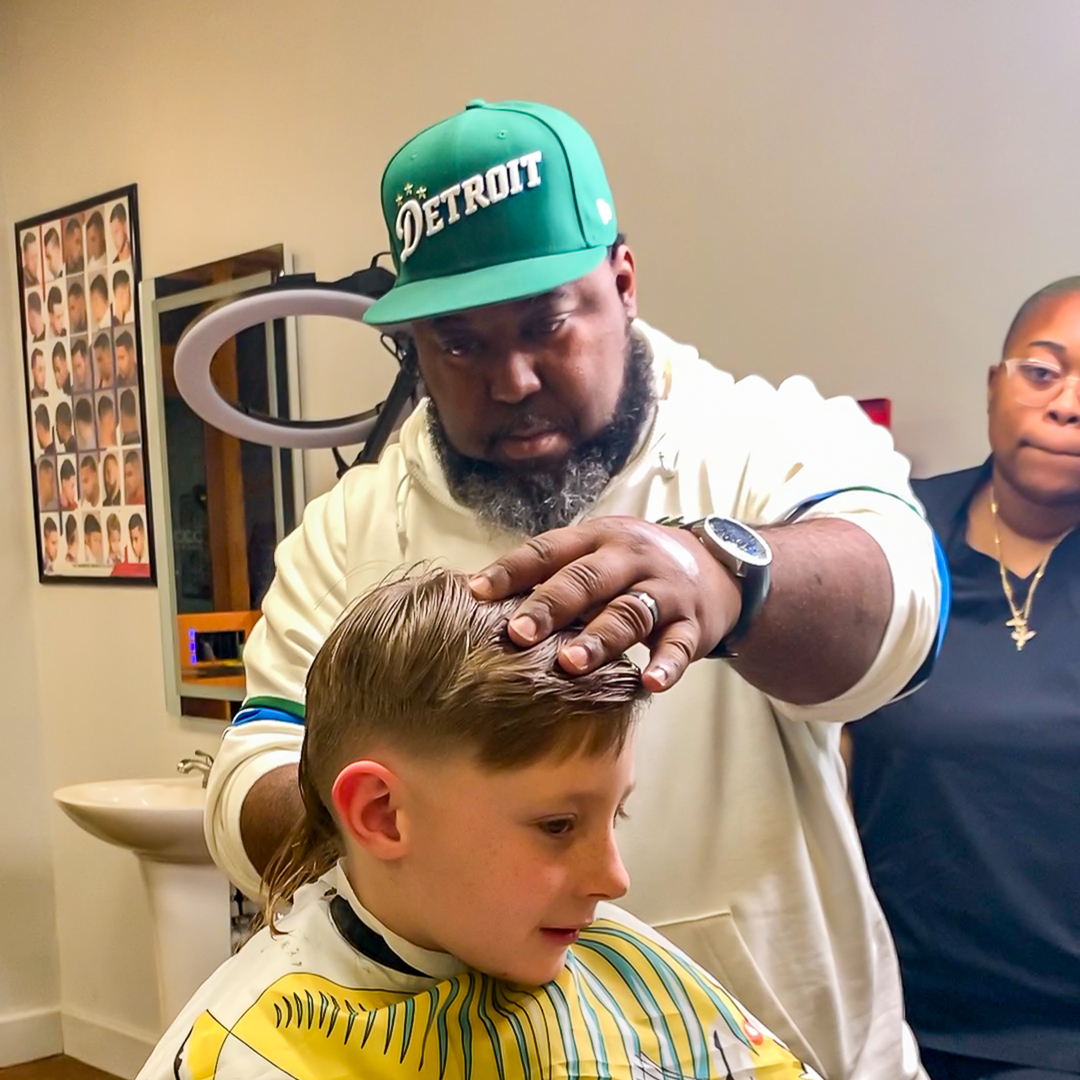 a person giving a haircut