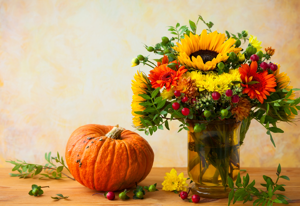 a pumpkin and flowers