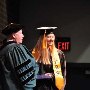 a person  getting a diploma