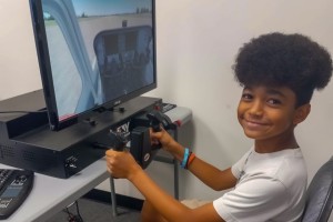 a child using a flight simulator